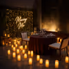 super romantic proposal in a cozy setting, surrounded by candles
