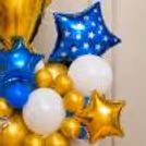 Tabletop Celebration Bouquet Of Gold, Silver And Blue Star Balloons And Themed Trophy Centrepiece.