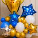 Metallic Chrome Balloons, White Latex Balloons And Foil Accents With Decorative Stars.