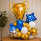 The Bouquet Of Blue, White And Gold Balloons Is Capped Off With A Giant Moon-Shaped Golden Trophy Balloon That Says World's Best Dad.