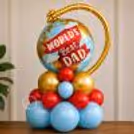 Balloons On A Wooden Table With Pastel Blue Colour And Chrome Metallic Details.