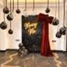 A luxurious Red Bow Marry Me Proposal Decor by CherishX with a sparkling black sequin backdrop, glowing neon sign, and romantic balloon ceiling.