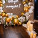 Romantic Decor with LED Candles, Flower Petals & Elegant Proposal for a memorable surprise.