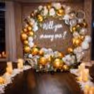 Romantic Proposal Decoration With Gold And White Balloon Ring, Neon “Will You Marry Me” Sign And LED Candles.