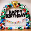 Special Day Setup With Colourful Arch And Golden Trophy Balloon Centrepiece.