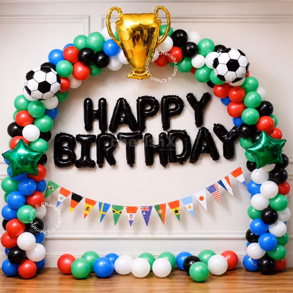 Special Day Setup With Colourful Arch And Golden Trophy Balloon Centrepiece.
