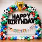 Special Day Setup With Colourful Arch And Golden Trophy Balloon Centrepiece.