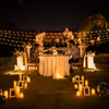 Private romantic dinner experience with glowing candles and dreamy décor.