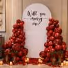 The balloon arch formed with red, stuffed with black balloons, looks like blood in veins.
