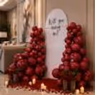Pastel pink roses on the arch softening the dramatic red effect with soft tones
