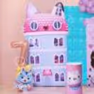 Dollhouse Birthday Backdrop With A Pastel Pink Theme And A Cut-Out Sequin Panel Display.