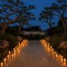 Premium candlelight proposal decor by CherishX with warm floor candles, floral styling, and a magical evening feel.