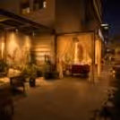 Couple enjoying a romantic cabana dinner with panoramic city skyline views