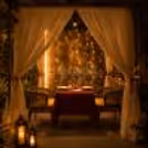 Private cabana dinner for couples with elegant romantic decorations