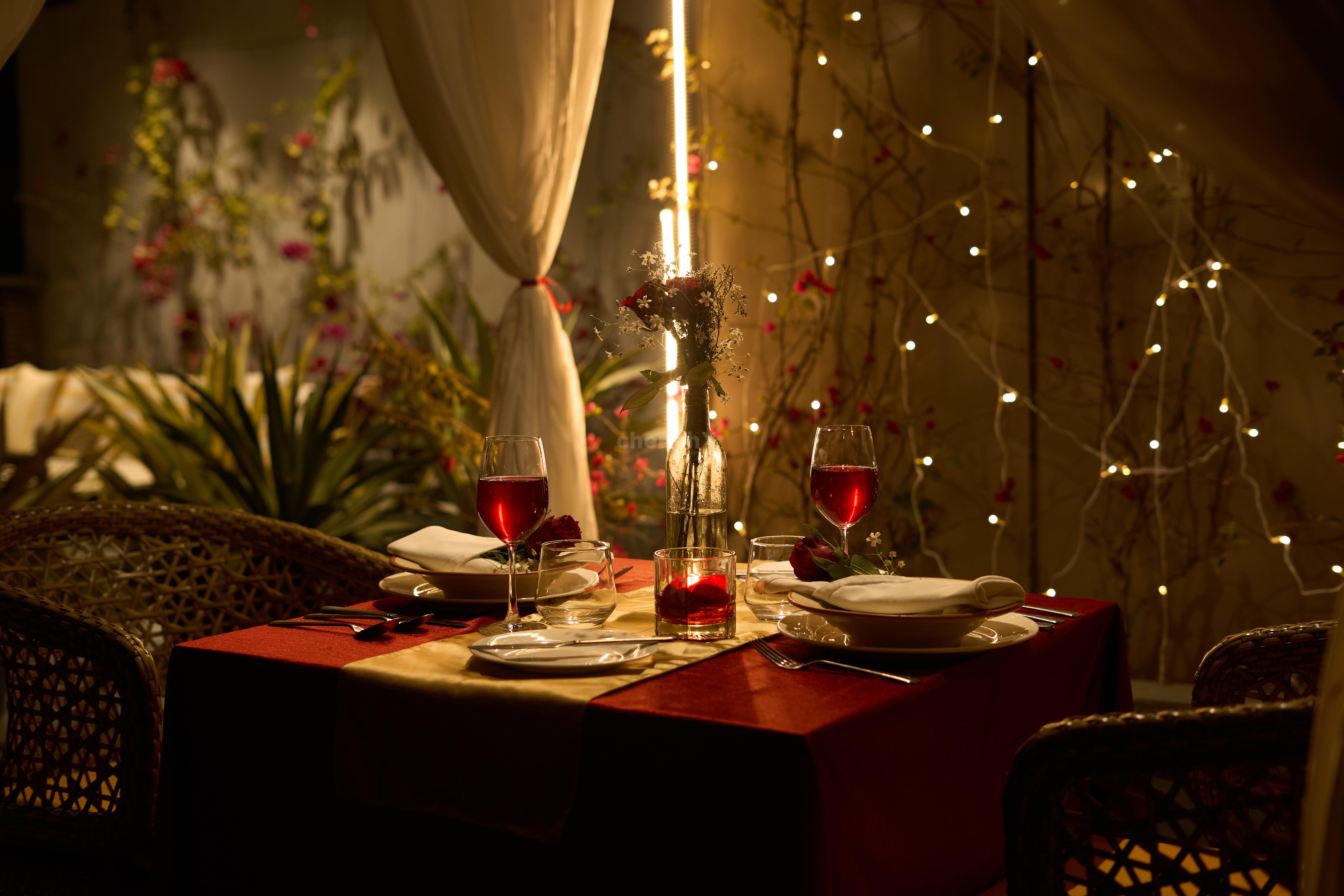 Skyline dining experience featuring a decorated cabana and candlelit ambience