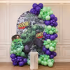 Superhero Birthday Backdrop With Comic Art, Green And Purple Balloon Arch.