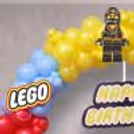 Lego Balloon Arch With Yellow, Green, Blue, And Red Balloons Around The Ring Frame.