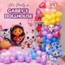 Cartoon character standees, heart foil balloons and pastel balloon arrangement for Gabby's Dollhouse birthday backdrop.