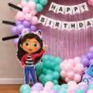 Gabby's Dollhouse Girl Standee with Pastel Balloon Ring Decor for a Kids Birthday Party.
