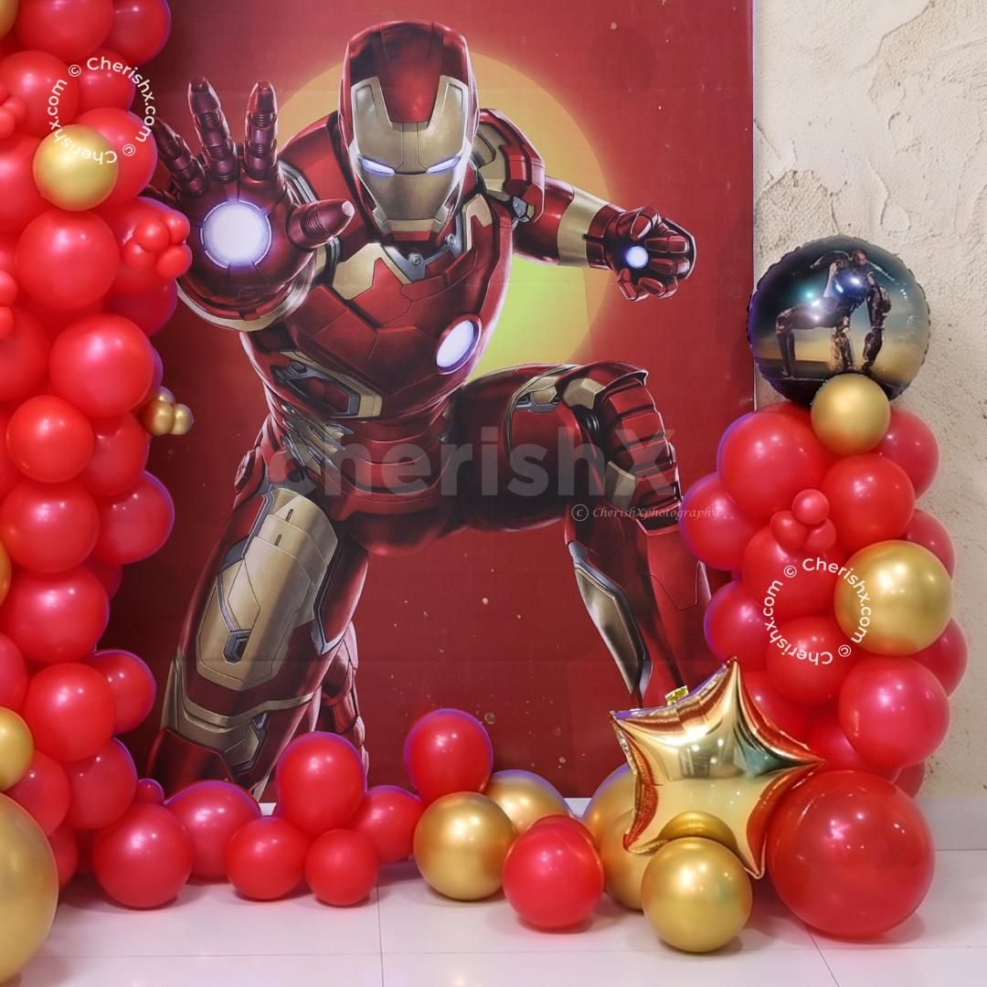 Small And Large Red Balloon Setup For The Superhero Party Decoration.