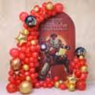Red and gold balloon arch for an Iron Man theme birthday celebration!