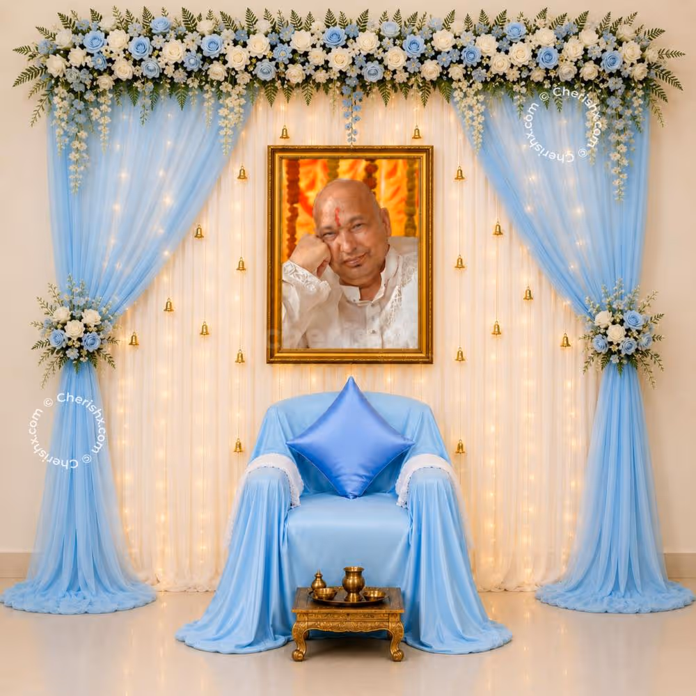 There Is A Calm, Contemplative Scene With White And Blue Flowers Cascading From Blue Satin Drapes.