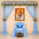 There Is A Calm, Contemplative Scene With White And Blue Flowers Cascading From Blue Satin Drapes.