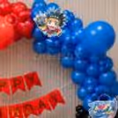 Beyblades Birthday Backdrop - Red and blue balloons, character cut out decoration on top section.