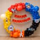 Colorful balloon arch, happy birthday banner and Beyblade theme decoration with ring stand.