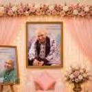 Large Spiritual Portrait Behind Warm Fairy Lights And Coordinated Pink Décor Elements.