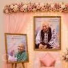 An Easel Stands Close To The Prayer Space And Displays Flower Clusters.