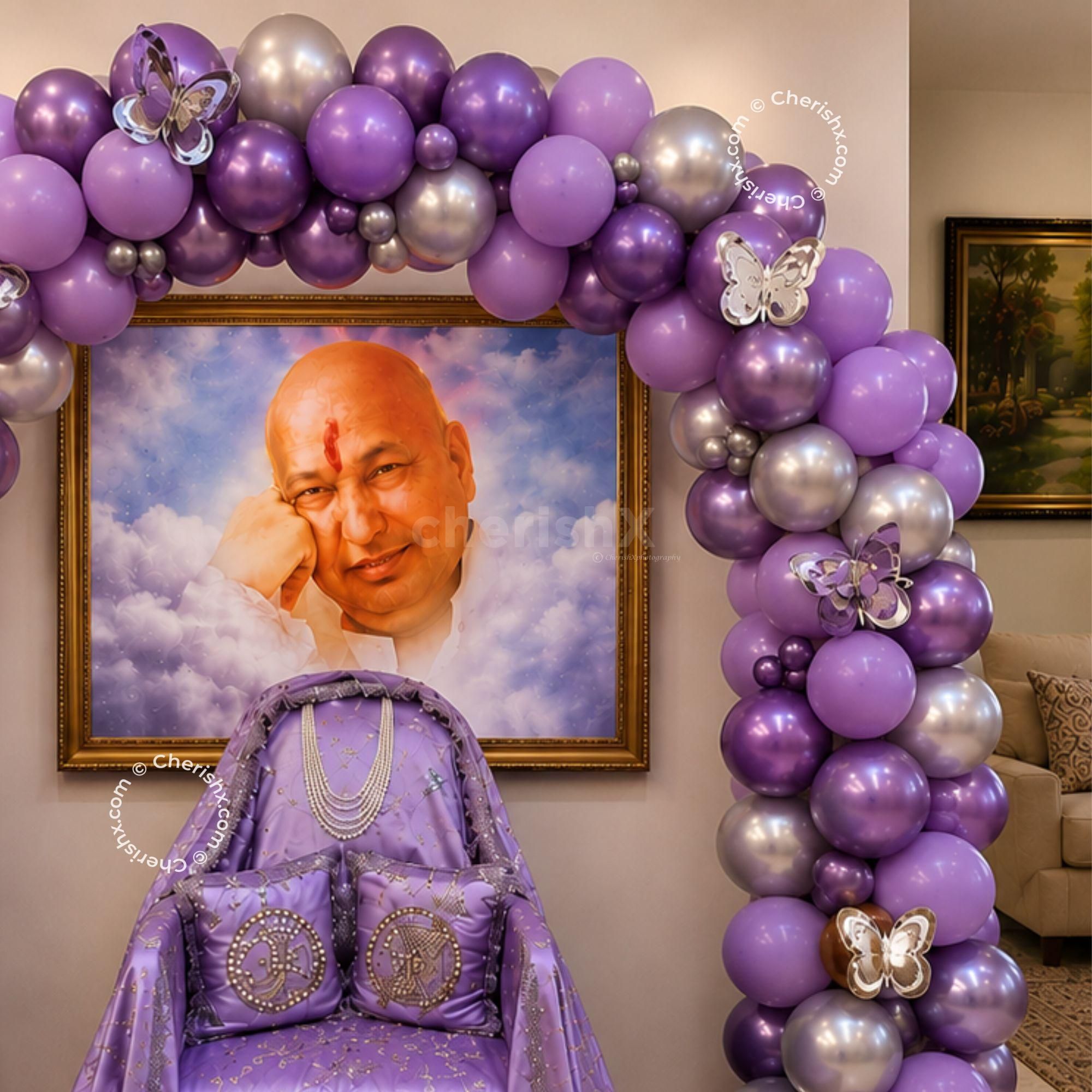 The Balloon Arch Is Adorned With Chrome Silver, Pastel Purple, And Metallic Balloons, All Embellished With 3d Butterfly Designs.