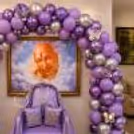 The Balloon Arch Is Adorned With Chrome Silver, Pastel Purple, And Metallic Balloons, All Embellished With 3d Butterfly Designs.