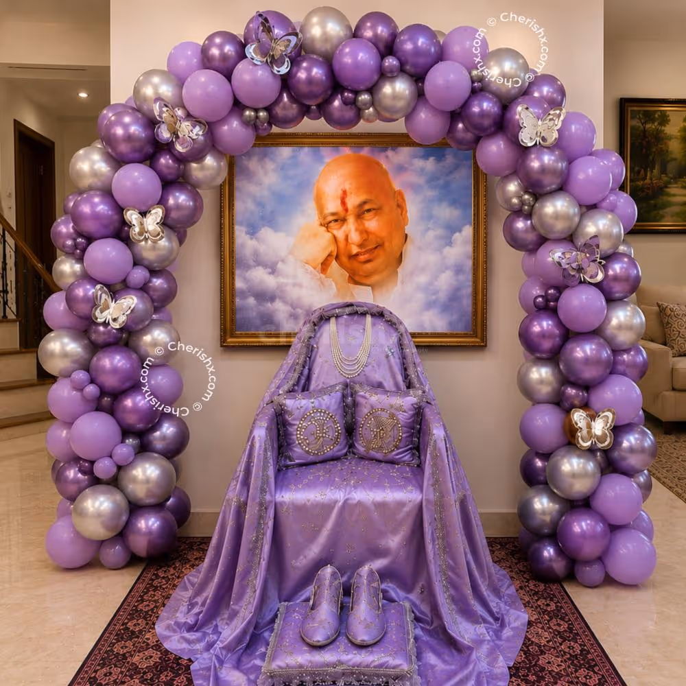 Devotional Seating Area Lined With A Lavender Balloon Arch With Silver Butterfly Accents Above A Spiritual Portrait In A Frame.
