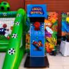 Close up of an arcade game for a boxing challenge with a score display.