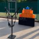 Angry Birds display stand with a giant slingshot and character blocks stacked on a table for an outdoor Angry Birds activity.