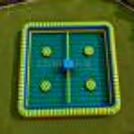 Top view of inflatable obstacle eliminator arena with circular balance pods and rotating arms of obstacles and a square play area.