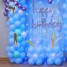 Aquaman Character Standees With Bright And Colourful Floor Balloon Decorations And Decorative Balloon Pillars.