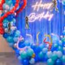 Children's Parties With Backdrop And Lots Of Blue And Green Balloons On The Floor.