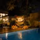 Exclusive poolside proposal setup at Grand Mercure with luxury décor, candlelit table, floral arrangements, and a romantic dining experience.