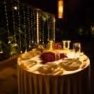 Grand red roses heart proposal experience with private candlelight dinner, luxury table setup, and beautifully decorated romantic venue.