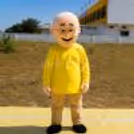 Patlu mascot in a yellow costume smiling and greeting young visitors at a children's event.