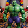 Live Hulk mascot entertaining children at a birthday party with fun interactions, superhero poses, and memorable photo opportunities.