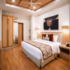 Spacious studio-style hotel accommodation with a fully equipped kitchenette and stylish living area.