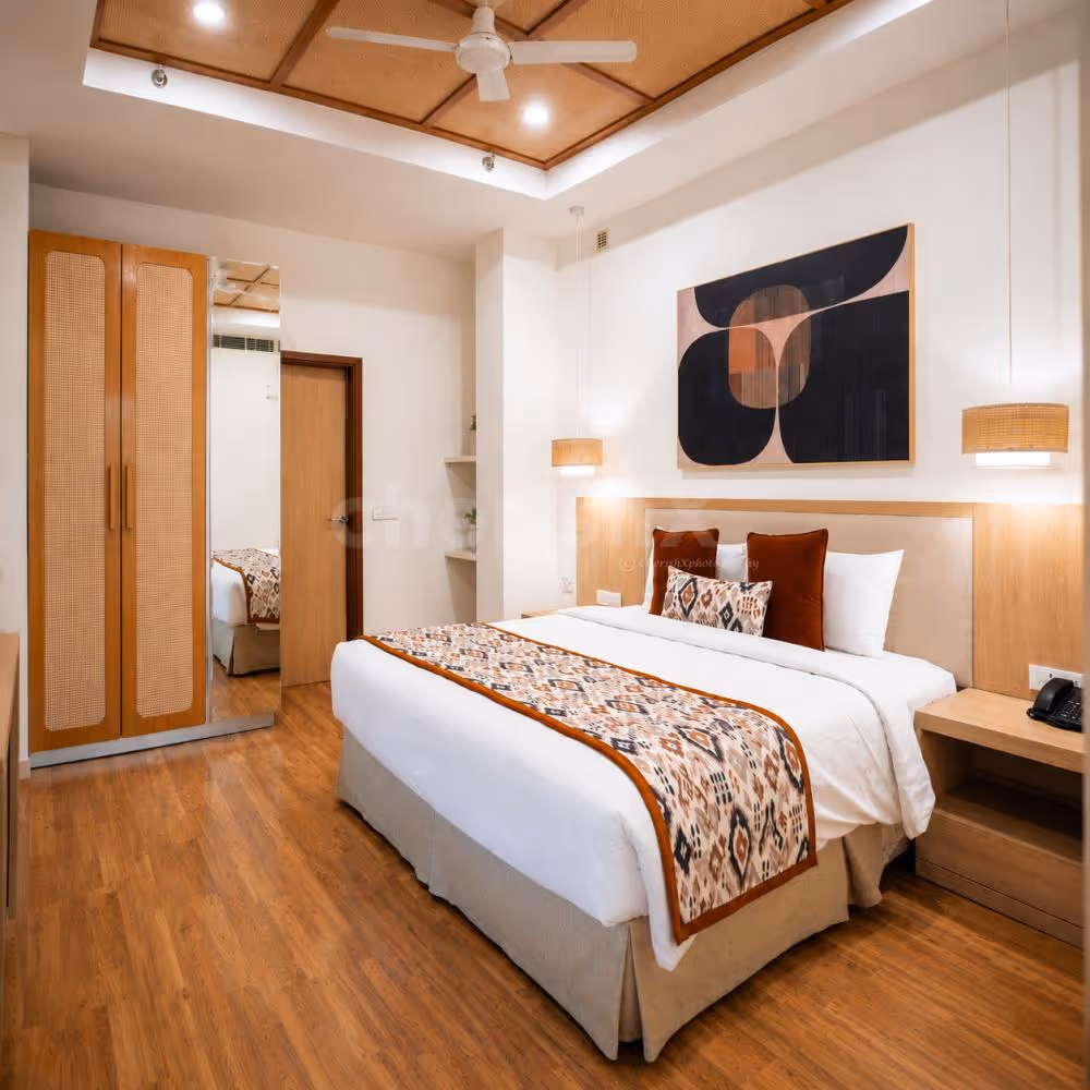 Spacious studio-style hotel accommodation with a fully equipped kitchenette and stylish living area.
