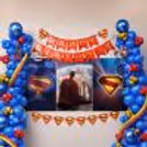 Showcase top with columns of balloons, comic theme decorations and festive birthday bunting.