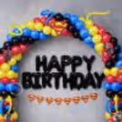 The top section has the iconic superhero logo, twisted ribbon balloons and colourful red, blue, yellow and black balloon designs.