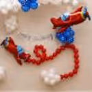 The lower decoration features a red balloon path, silver cursive birthday bunting, soft white balloon bunches and a balloon airplane foil plane.