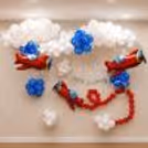 Fully decorated airplane birthday with floating white balloon clouds, 3 red airplane foil balloons, blue balloon clusters, and a silver Happy Birthday banner.