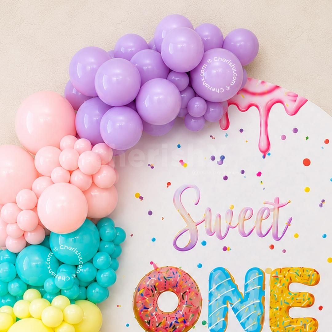 Colourful Arch With A Donut And A Sweet-Themed Party Decor.